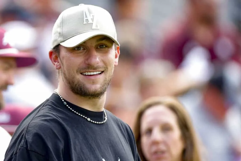 COLLEGE STATION, TEXAS - SEPTEMBER 16: Johnny Manziel looks on during the first half of a game between the Texas A&M Aggies and the Louisiana Monroe Warhawks at Kyle Field on September 16, 2023 in College Station, Texas.