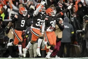 CLEVELAND, OHIO - NOVEMBER 16: Devin Bush #30 of the Cleveland Browns celebrates a touchdown after an interception against the Baltimore Ravens with teammates Grant Delpit #9 and Ronnie Hickman #33 during the second quarter at Huntington Bank Field on November 16, 2025 in Cleveland, Ohio.