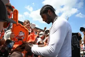BEREA, OHIO - JULY 28: Shedeur Sanders #12 of the Cleveland Browns signs autographs after Cleveland Browns training camp at CrossCountry Mortgage Campus on July 28, 2025 in Berea, Ohio.