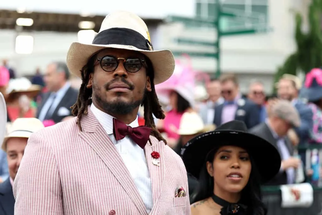 LOUISVILLE, KENTUCKY - MAY 07: NFL player Cam Newton watches an undercard race before the running of the 148th Kentucky Derby at Churchill Downs on May 07, 2022 in Louisville, Kentucky.