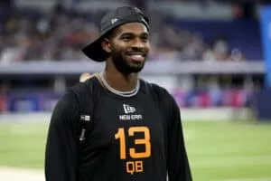 INDIANAPOLIS, INDIANA - MARCH 01: Shedeur Sanders #QB13 of Colorado looks on during the NFL Scouting Combine at Lucas Oil Stadium on March 01, 2025 in Indianapolis, Indiana.