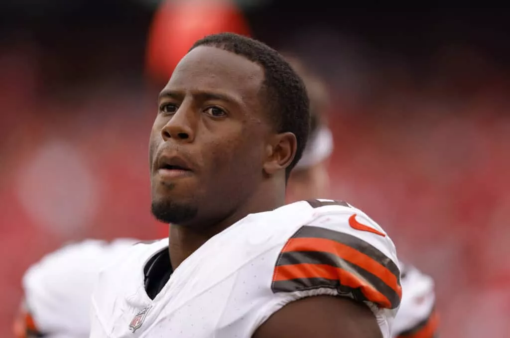 KANSAS CITY, MISSOURI - AUGUST 26: Nick Chubb #24 of the Cleveland Browns smiles during the second quarter on the sidelines of a preseason game against the Kansas City Chiefs at GEHA Field at Arrowhead Stadium on August 26, 2023 in Kansas City, Missouri.