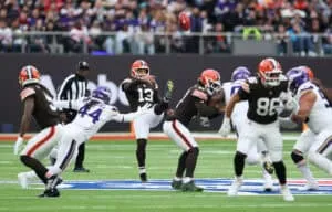 LONDON, ENGLAND - OCTOBER 05: Corey Bojorquez of the Cleveland Browns punts the ball under pressure from Josh Metellus of Minnesota Vikings during the fourth quarter in the NFL 2025 game between Minnesota Vikings and Cleveland Browns at Tottenham Hotspur Stadium on October 05, 2025 in London, England.""
