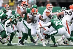 EAST RUTHERFORD, NEW JERSEY - NOVEMBER 09: Quinshon Judkins #10 of the Cleveland Browns carries the ball against Tony Adams #22 of the New York Jets during the first half in the game at MetLife Stadium on November 09, 2025 in East Rutherford, New Jersey.
