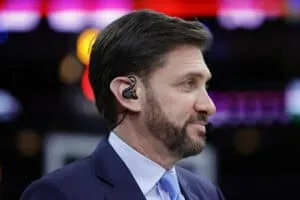 PHILADELPHIA, PENNSYLVANIA - DECEMBER 11: Mike Greenberg of ESPN looks on during a game between the Philadelphia 76ers and the Golden State Warriors at Wells Fargo Center on December 11, 2021 in Philadelphia, Pennsylvania.