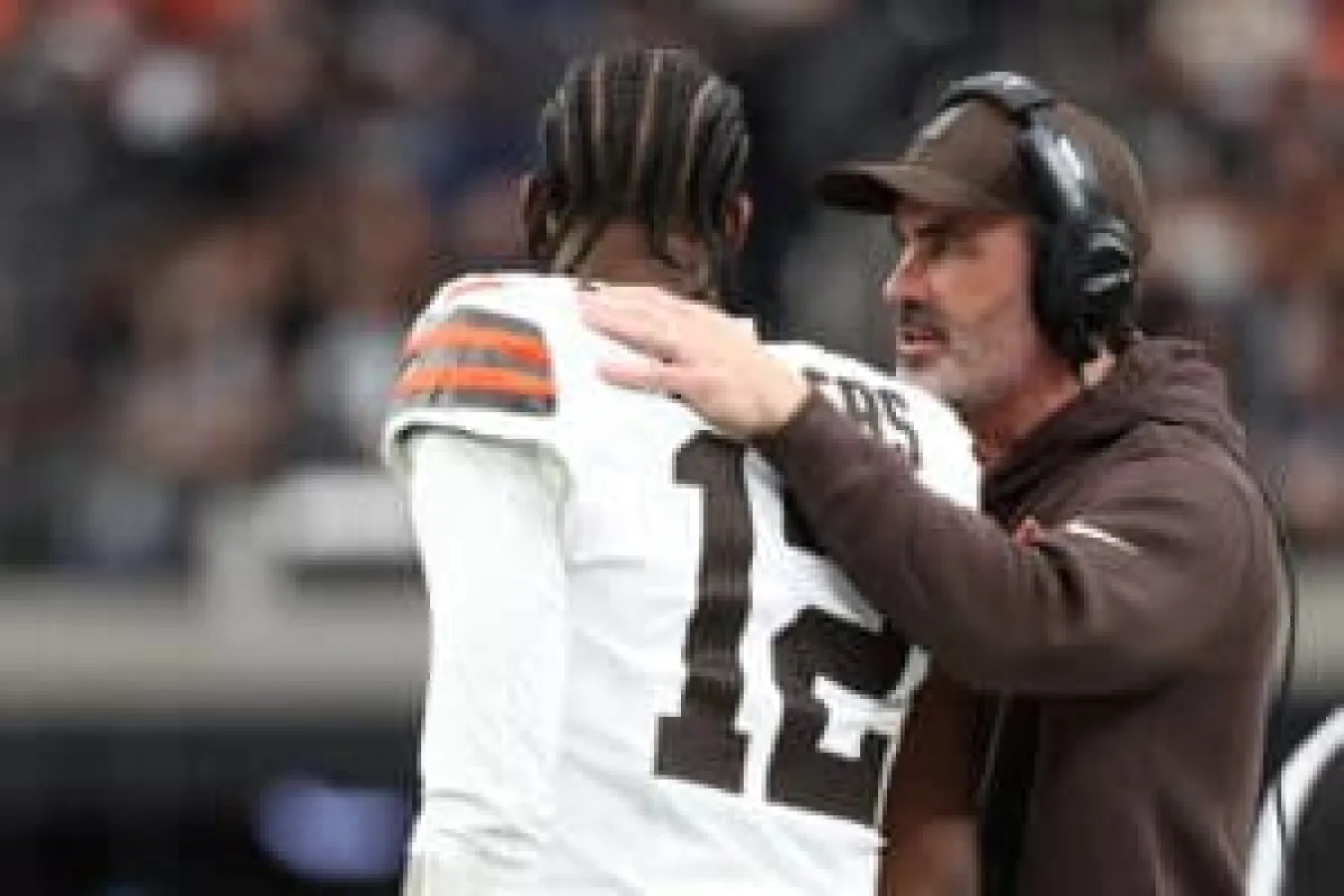 LAS VEGAS, NEVADA - NOVEMBER 23: Head coach Kevin Stefanski talks to Shedeur Sanders #12 of the Cleveland Browns during the first quarter against the Las Vegas Raiders at Allegiant Stadium on November 23, 2025 in Las Vegas, Nevada.