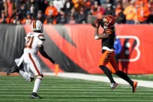 CINCINNATI, OHIO - DECEMBER 22: Ja'Marr Chase #1 of the Cincinnati Bengals makes a catch against Denzel Ward #21 of the Cleveland Browns during the first quarter at Paycor Stadium on December 22, 2024 in Cincinnati, Ohio.