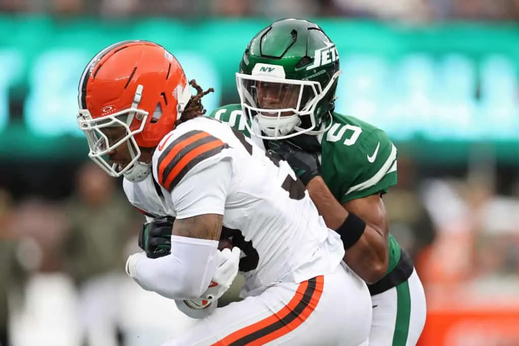 EAST RUTHERFORD, NEW JERSEY - NOVEMBER 09: Devin Bush #30 of the Cleveland Browns intercepts the ball against Garrett Wilson #5 of the New York Jets during the first half in the game at MetLife Stadium on November 09, 2025 in East Rutherford, New Jersey.