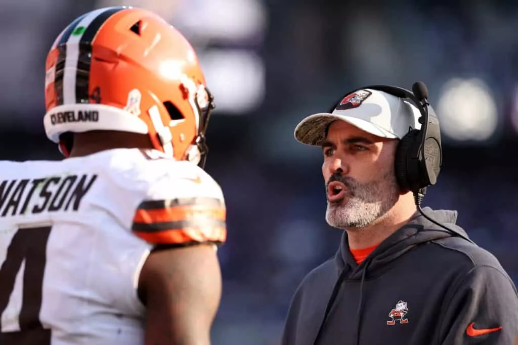 BALTIMORE, MARYLAND - NOVEMBER 12: Head coach Kevin Stefanski of the Cleveland Browns speaks to Deshaun Watson #4 during the second half against the Baltimore Ravens at M&T Bank Stadium on November 12, 2023 in Baltimore, Maryland.