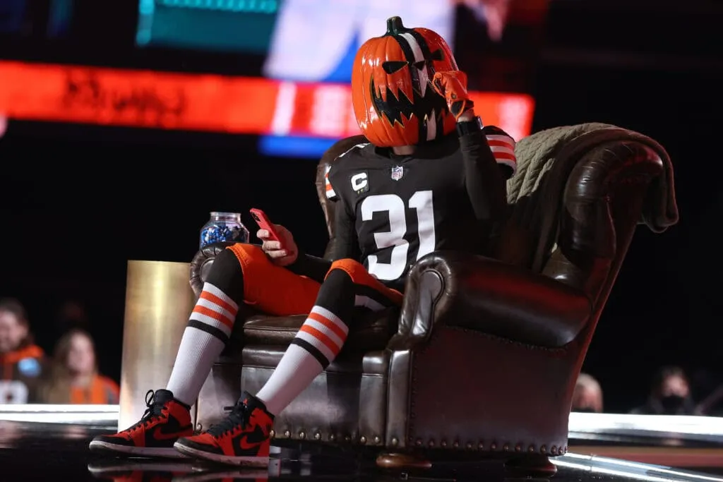 CLEVELAND, OHIO - APRIL 29: A Cleveland Browns fan sits onstage during round one of the 2021 NFL Draft at the Great Lakes Science Center on April 29, 2021 in Cleveland, Ohio.