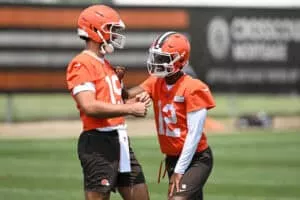 BEREA, OHIO - JUNE 04: Joe Flacco #15 and Shedeur Sanders #12 of the Cleveland Browns laugh during Cleveland Browns OTA offseason workouts at CrossCountry Mortgage Campus on June 04, 2025 in Berea, Ohio.