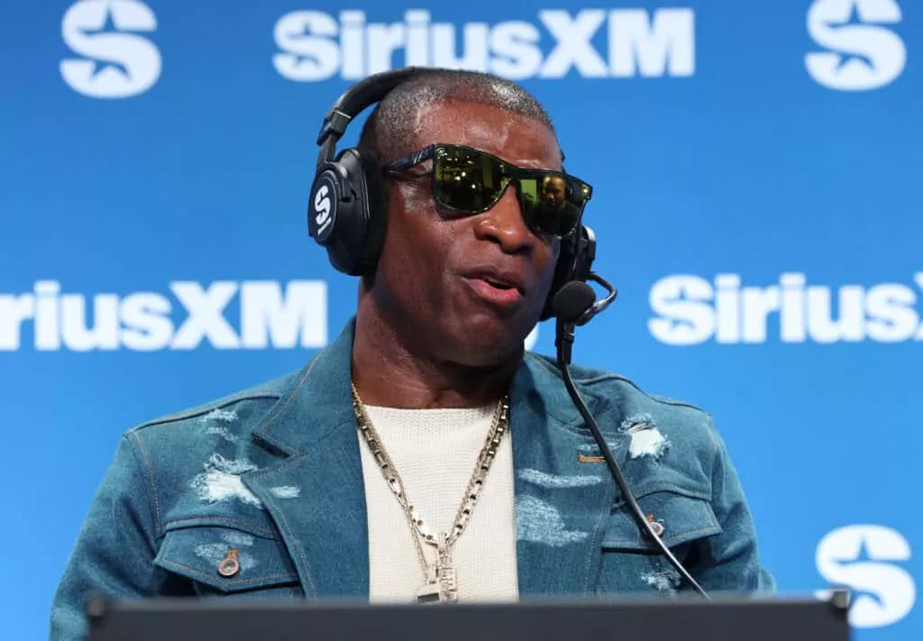 NEW ORLEANS, LOUISIANA - FEBRUARY 07: Deion Sanders speaks on SiriusXM on radio row at Super Bowl LIX on February 07, 2025 in New Orleans, Louisiana.