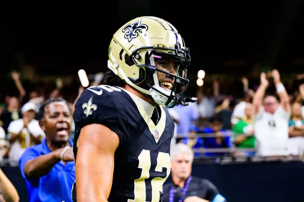 NEW ORLEANS, LOUISIANA - SEPTEMBER 22: Chris Olave #12 of the New Orleans Saints celebrates a touchdown reception against the Philadelphia Eagles during the fourth quarter at Caesars Superdome on September 22, 2024 in New Orleans, Louisiana.