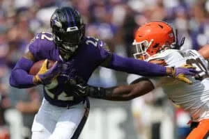 BALTIMORE, MARYLAND - SEPTEMBER 14: Alex Wright #91 of the Cleveland Browns tackles Derrick Henry #22 of the Baltimore Ravens during the third quarter at M&T Bank Stadium on September 14, 2025 in Baltimore, Maryland.