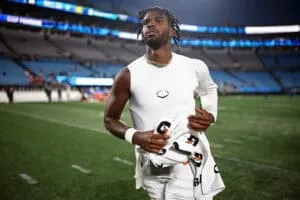 CHARLOTTE, NORTH CAROLINA - AUGUST 08: Quarterback Shedeur Sanders #12 of the Cleveland Browns runs off the field following their victory over the Carolina Panthers in the NFL Preseason 2025 game at Bank of America Stadium on August 08, 2025 in Charlotte, North Carolina.
