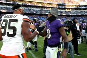 BALTIMORE, MARYLAND - NOVEMBER 12: Myles Garrett #95 of the Cleveland Browns and Lamar Jackson #8 of the Baltimore Ravens embrace after the game at M&T Bank Stadium on November 12, 2023 in Baltimore, Maryland.