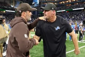 DETROIT, MICHIGAN - SEPTEMBER 28: Head coach Kevin Stefanski of the Cleveland Browns and Head coach Dan Campbell of the Detroit Lions embrace after the game at Ford Field on September 28, 2025 in Detroit, Michigan.