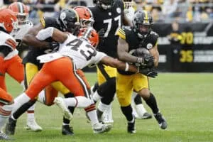 PITTSBURGH, PENNSYLVANIA - OCTOBER 12: Jaylen Warren #30 of the Pittsburgh Steelers runs against Mohamoud Diabate #43 of the Cleveland Browns during the third quarter in the game at Acrisure Stadium on October 12, 2025 in Pittsburgh, Pennsylvania.