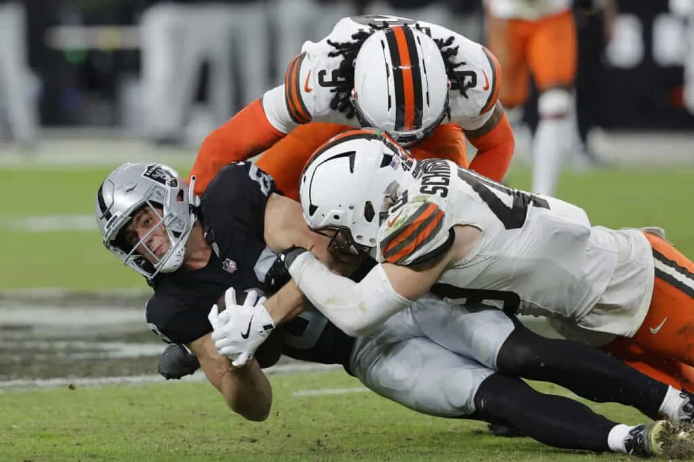 LAS VEGAS, NEVADA - NOVEMBER 23: Brock Bowers #89 of the Las Vegas Raiders is tackled by Carson Schwesinger #49 of the Cleveland Browns in the game at Allegiant Stadium on November 23, 2025 in Las Vegas, Nevada.