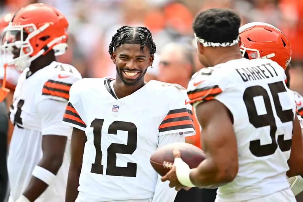 CLEVELAND, OHIO - AUGUST 23: Quarterback Shedeur Sanders #12 talks to defensive end Myles Garrett #95 of the Cleveland Browns before an NFL Preseason 2025 against the Los Angeles Rams at Huntington Bank Field on August 23, 2025 in Cleveland, Ohio.