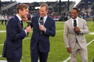CANTON, OHIO - AUGUST 04: (L to R) NBC Sports commentators Jac Collinsworth, Chris Simms and Rodney Harrison laugh during a segment prior to the 2022 Pro Hall of Fame Game between the Jacksonville Jaguars and the Las Vegas Raiders at Tom Benson Hall of Fame Stadium on August 04, 2022 in Canton, Ohio.