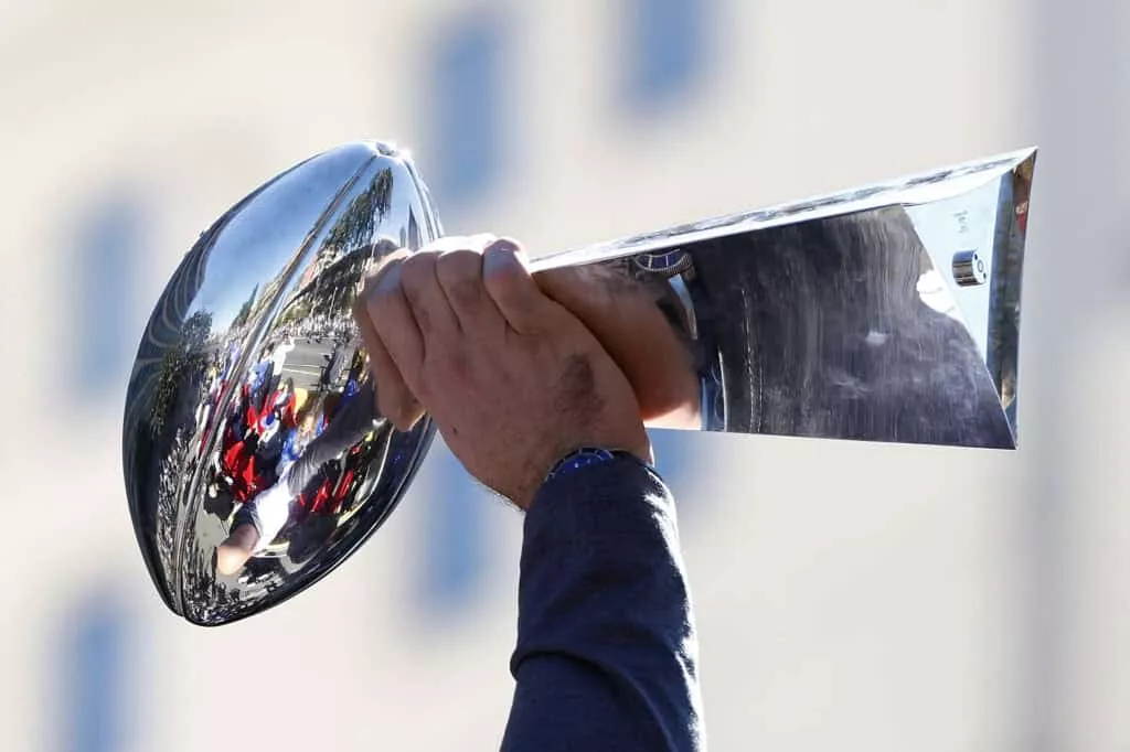 LOS ANGELES, CALIFORNIA - FEBRUARY 16: Andrew Whitworth #77 of the Los Angeles Rams raises the Vince Lombardi trophy during the Los Angeles Rams Super Bowl LVI victory parade on February 16, 2022 in Los Angeles, California.