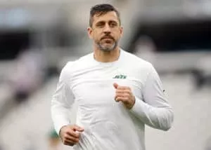JACKSONVILLE, FLORIDA - DECEMBER 15: Aaron Rodgers #8 of the New York Jets warms up before the game against the Jacksonville Jaguars at EverBank Stadium on December 15, 2024 in Jacksonville, Florida.