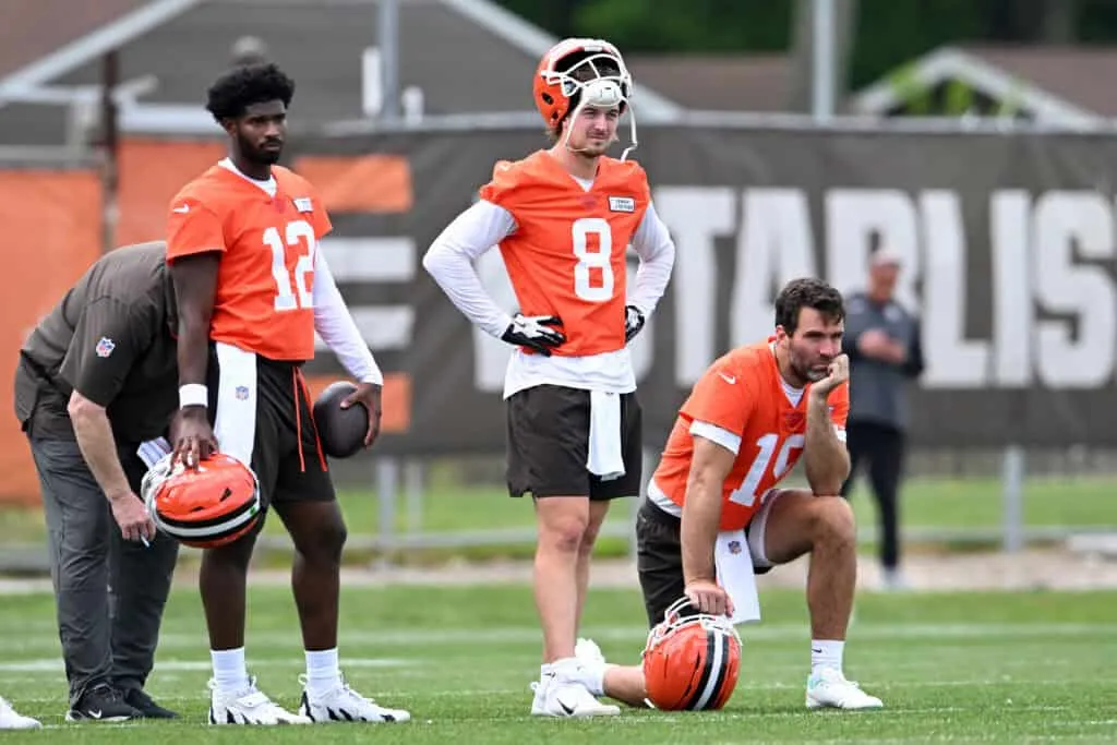 BEREA, OHIO - JUNE 04: (L-R) Shedeur Sanders #12, Kenny Pickett #8 and Joe Flacco #15 of the Cleveland Browns watch a drill during Cleveland Browns OTA offseason workouts at CrossCountry Mortgage Campus on June 04, 2025 in Berea, Ohio.