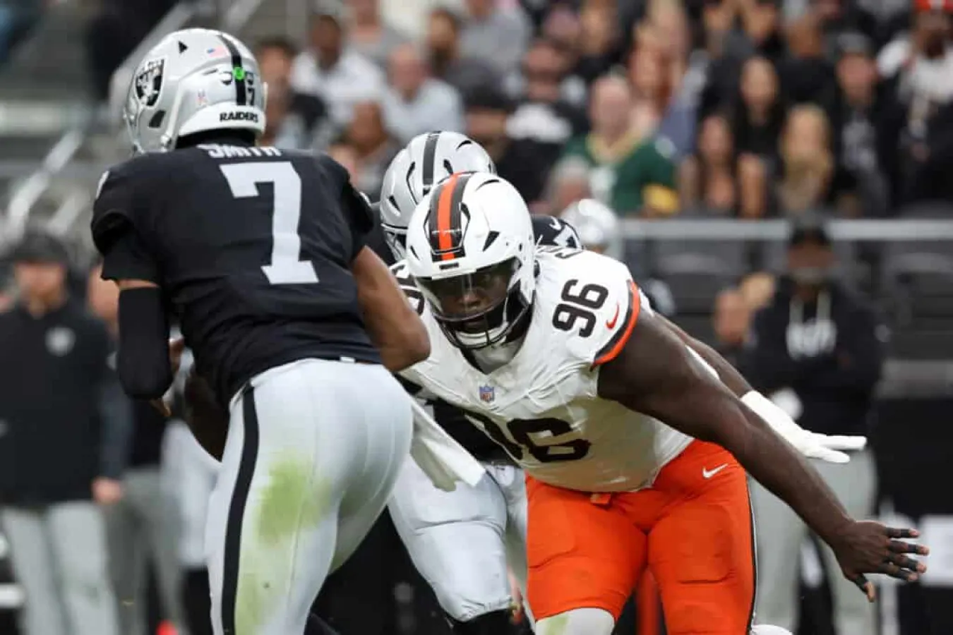 LAS VEGAS, NEVADA - NOVEMBER 23: Maliek Collins #96 of the Cleveland Browns pressures Geno Smith #7 of the Las Vegas Raiders during the first quarter of a game at Allegiant Stadium on November 23, 2025 in Las Vegas, Nevada.