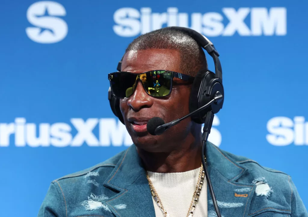 NEW ORLEANS, LOUISIANA - FEBRUARY 07: Deion Sanders speaks on SiriusXM on radio row at Super Bowl LIX on February 07, 2025 in New Orleans, Louisiana.