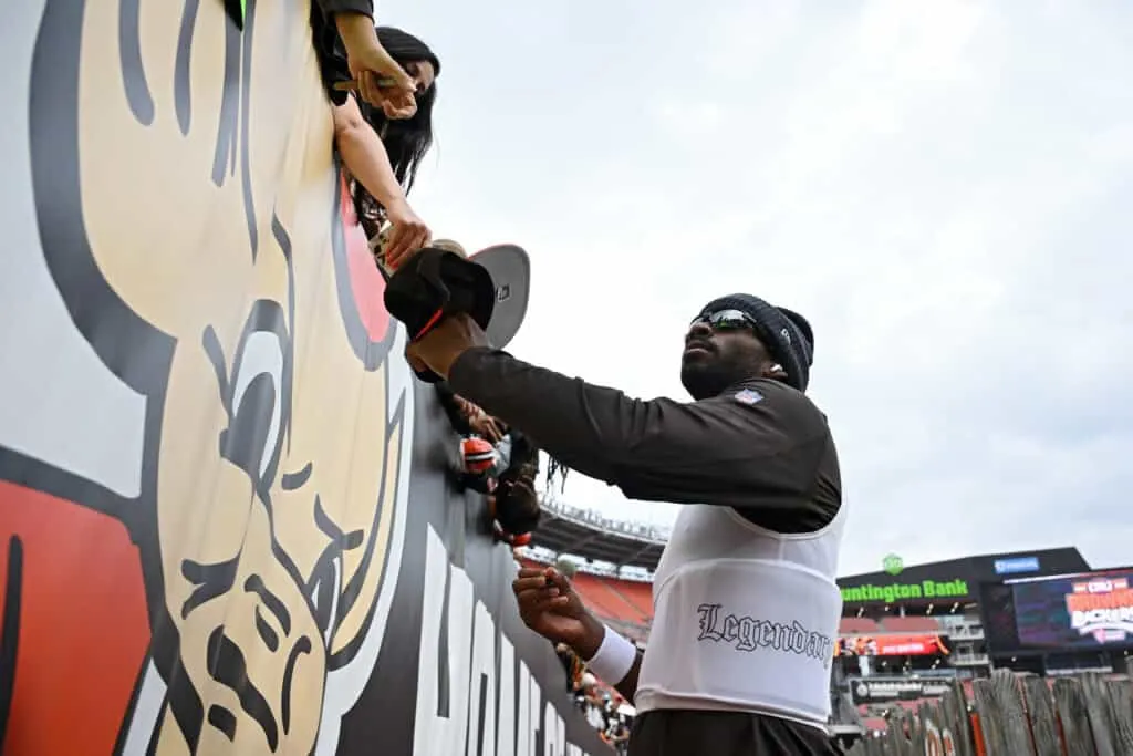 CLEVELAND, OHIO - OCTOBER 19: Shedeur Sanders #12 of the Cleveland Browns signs autographs prior to a game against the Miami Dolphins at Huntington Bank Field on October 19, 2025 in Cleveland, Ohio.