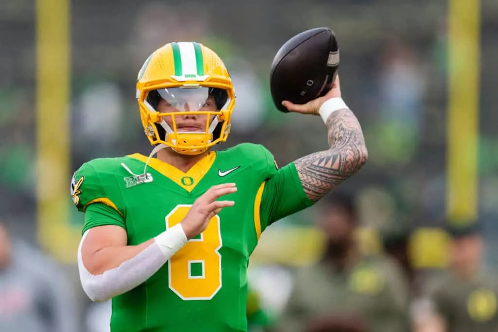 EUGENE, OREGON - NOVEMBER 9: Quarterback Dillon Gabriel #8 of the Oregon Ducks warms up before the game against the Maryland Terrapins at Autzen Stadium on November 9, 2024 in Eugene, Oregon.
