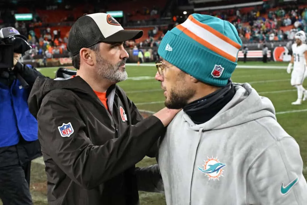CLEVELAND, OHIO - DECEMBER 29: Head coach Kevin Stefanski of the Cleveland Browns and head coach Mike McDaniel of the Miami Dolphins embrace after the game at Huntington Bank Field on December 29, 2024 in Cleveland, Ohio.