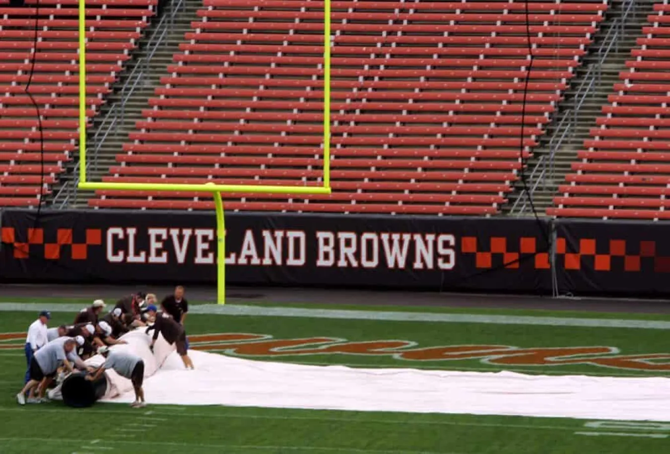 CLEVELAND - SEPTEMBER 09: Members of the groundcrew remove the tarps before the Cleveland Browns play the Pittsburgh Steelers in their season opening game at Cleveland Browns Stadium on Septmber 9, 2007 in Cleveland, Ohio.