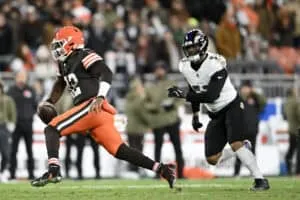 CLEVELAND, OHIO - NOVEMBER 16: Shedeur Sanders #12 of the Cleveland Browns scrambles with the ball against the Baltimore Ravens during the fourth quarter at Huntington Bank Field on November 16, 2025 in Cleveland, Ohio.
