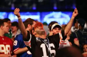 NEW YORK, NY - MAY 08: A fan reacts as Johnny Manziel of the Texas A&M Aggies is picked #22 overall by the Cleveland Browns during the first round of the 2014 NFL Draft at Radio City Music Hall on May 8, 2014 in New York City.