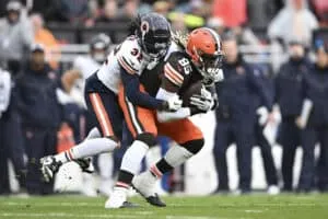 CLEVELAND, OHIO - DECEMBER 17: David Njoku #85 of the Cleveland Browns catches a pass in front of Terell Smith #32 of the Chicago Bears during the first quarter at Cleveland Browns Stadium on December 17, 2023 in Cleveland, Ohio.