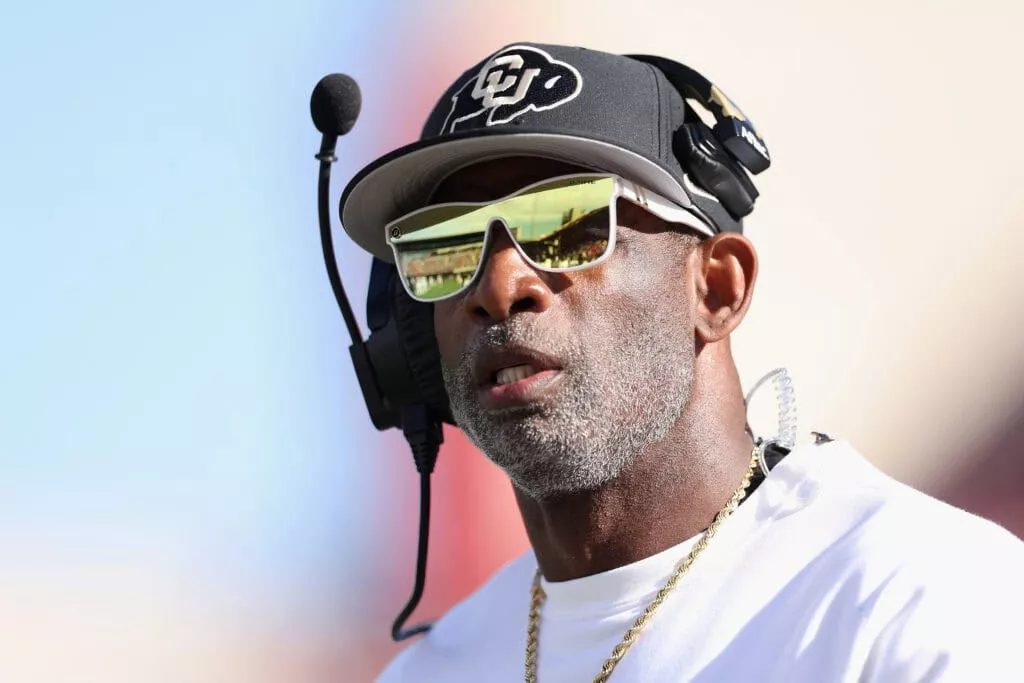TUCSON, ARIZONA - OCTOBER 19: Head coach Deion Sanders of the Colorado Buffaloes reacts on the field during the NCAAF game against the Arizona Wildcats at Arizona Stadium on October 19, 2024 in Tucson, Arizona.