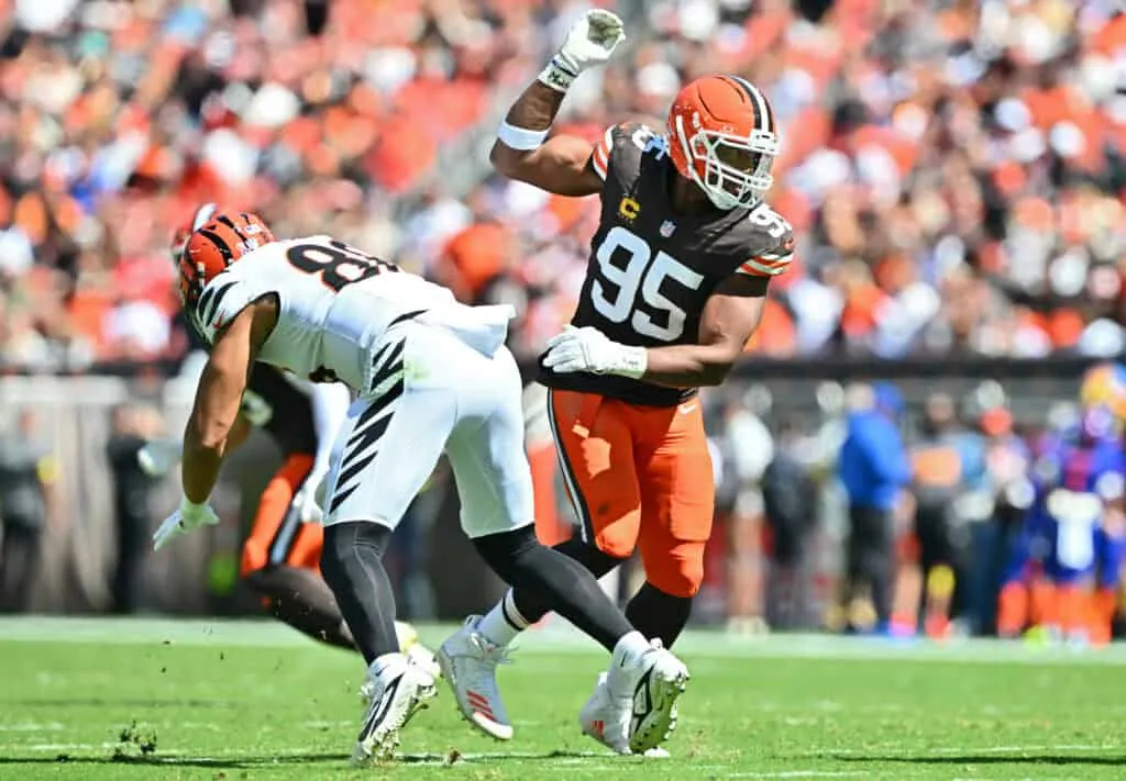 CLEVELAND, OHIO - SEPTEMBER 07: Myles Garrett #95 of the Cleveland Browns makes a move on Andrei Iosivas #80 of the Cincinnati Bengals during the second quarter during the game at Huntington Bank Field on September 07, 2025 in Cleveland, Ohio.