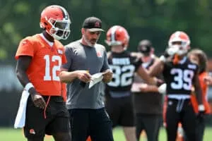 BEREA, OHIO - JUNE 11: Head coach Kevin Stefanski of the Cleveland Browns instructs Shedeur Sanders #12 during Cleveland Browns mandatory minicamp at CrossCountry Mortgage Campus on June 11, 2025 in Berea, Ohio.