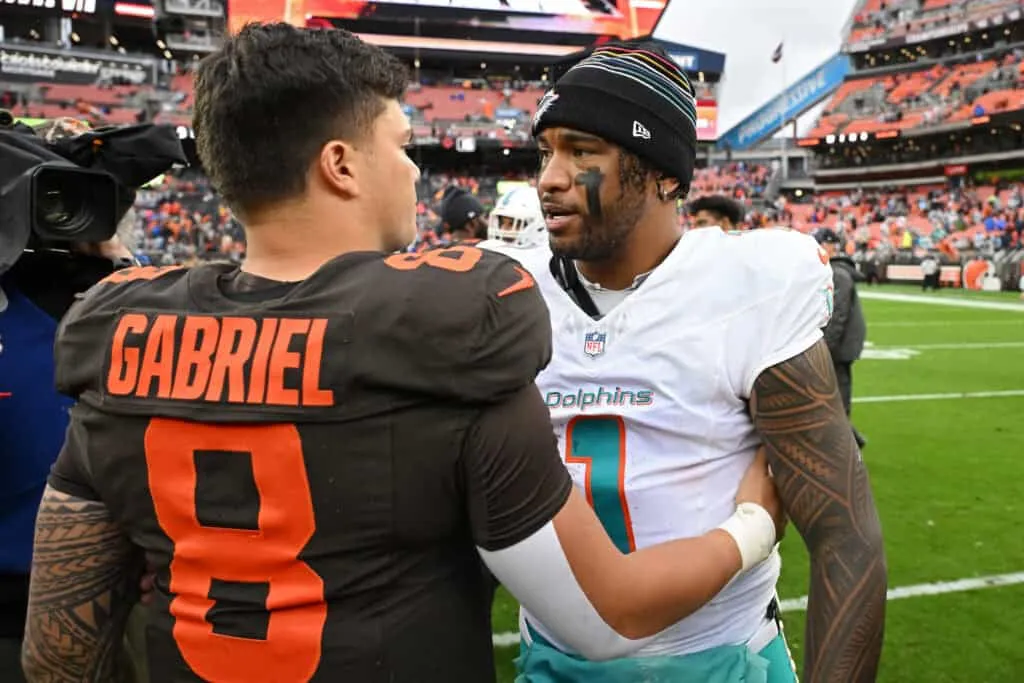 CLEVELAND, OHIO - OCTOBER 19: Dillon Gabriel #8 of the Cleveland Browns and Tua Tagovailoa #1 of the Miami Dolphins meet on the field after their game at Huntington Bank Field on October 19, 2025 in Cleveland, Ohio.