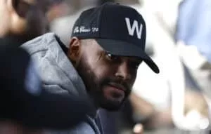 FRISCO, TEXAS - JANUARY 27: Dallas Cowboys quarterback Dak Prescott #4 looks on from the audience as Brian Schottenheimer is introduced as the new head coach of the Dallas Cowboys at The Star in Frisco on January 27, 2025 in Frisco, Texas.