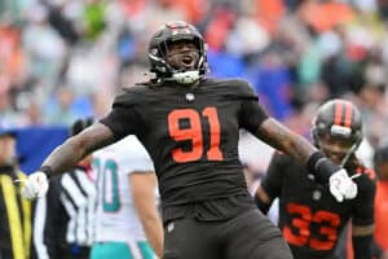 CLEVELAND, OHIO - OCTOBER 19: Alex Wright #91 of the Cleveland Browns celebrates after a play against the Miami Dolphins in the game at Huntington Bank Field on October 19, 2025 in Cleveland, Ohio.