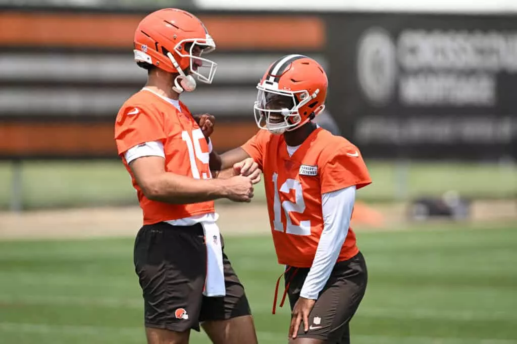 BEREA, OHIO - JUNE 04: Joe Flacco #15 and Shedeur Sanders #12 of the Cleveland Browns laugh during Cleveland Browns OTA offseason workouts at CrossCountry Mortgage Campus on June 04, 2025 in Berea, Ohio.