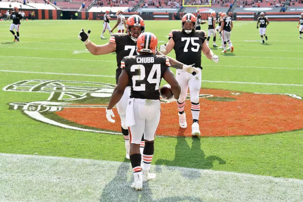 CLEVELAND, OHIO - SEPTEMBER 27: Offensive tackle Jack Conklin #78 and offensive guard Joel Bitonio #75 of the Cleveland Browns celebrate with running back Nick Chubb #24 of the Cleveland Browns after Chubb ran for a touchdown against the Washington Football Team during the fourth quarter at FirstEnergy Stadium on September 27, 2020 in Cleveland, Ohio. The Browns defeated the Washington Football Team 34-20.
