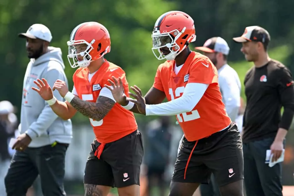 BEREA, OHIO - JUNE 11: Shedeur Sanders #12 and Dillon Gabriel #5 of the Cleveland Browns run a drill during Cleveland Browns mandatory minicamp at CrossCountry Mortgage Campus on June 11, 2025 in Berea, Ohio.