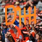 browns fans holding up a defense sign