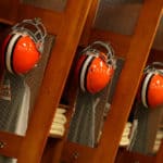 Cleveland Browns helmets hang in the Browns locker room at Cleveland Browns Stadium in Cleveland, Ohio.