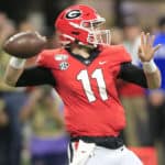 Quarterback Jake Fromm (11) of the Georgia Bulldogs passes during the SEC Championship Game between the UGA Bulldogs and the LSU Tigers on December 7, 2019 at the Mercedes-Benz Stadium in Atlanta, Georgia.