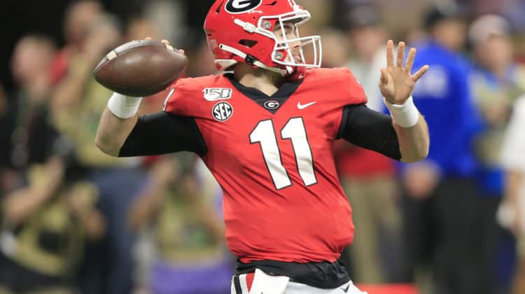 Quarterback Jake Fromm (11) of the Georgia Bulldogs passes during the SEC Championship Game between the UGA Bulldogs and the LSU Tigers on December 7, 2019 at the Mercedes-Benz Stadium in Atlanta, Georgia.